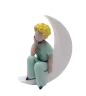 figurine-le-petit-prince-assis-sur-la-lune